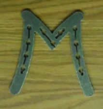 Horse shoe letter M unfinished