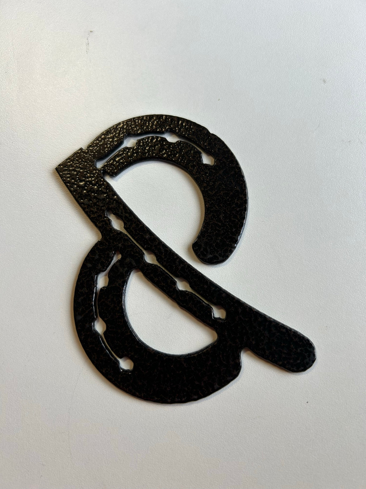 Horseshoe & (Ampersand) – finished plasma-cut steel